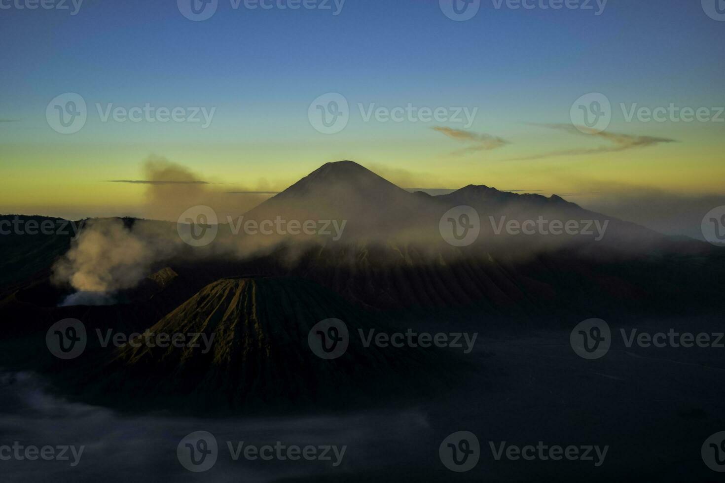 Beautiful colorful sunrise over Mount Bromo and wild island in Mount Bromo National Park photo