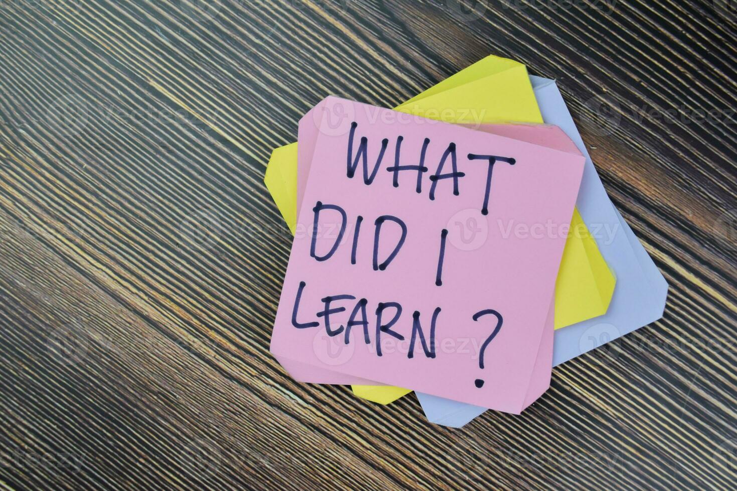 Concept of What Did I Learn Personal Development write on sticky notes isolated on Wooden Table. photo