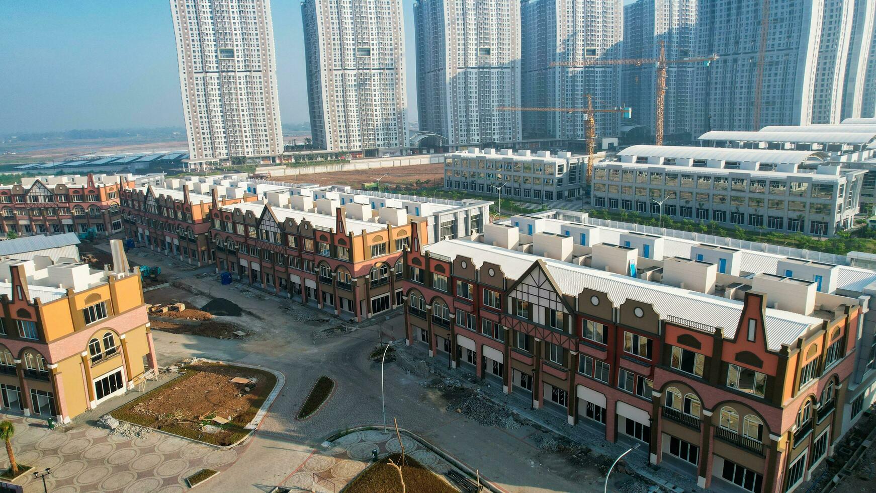 Aerial view of Amsterdam Dutch dancing houses above the southeast of the jakarta river in the spring landscape of the old European city at Pantai Indah Kapuk. Jakarta, Indonesia, June 23, 2022 photo