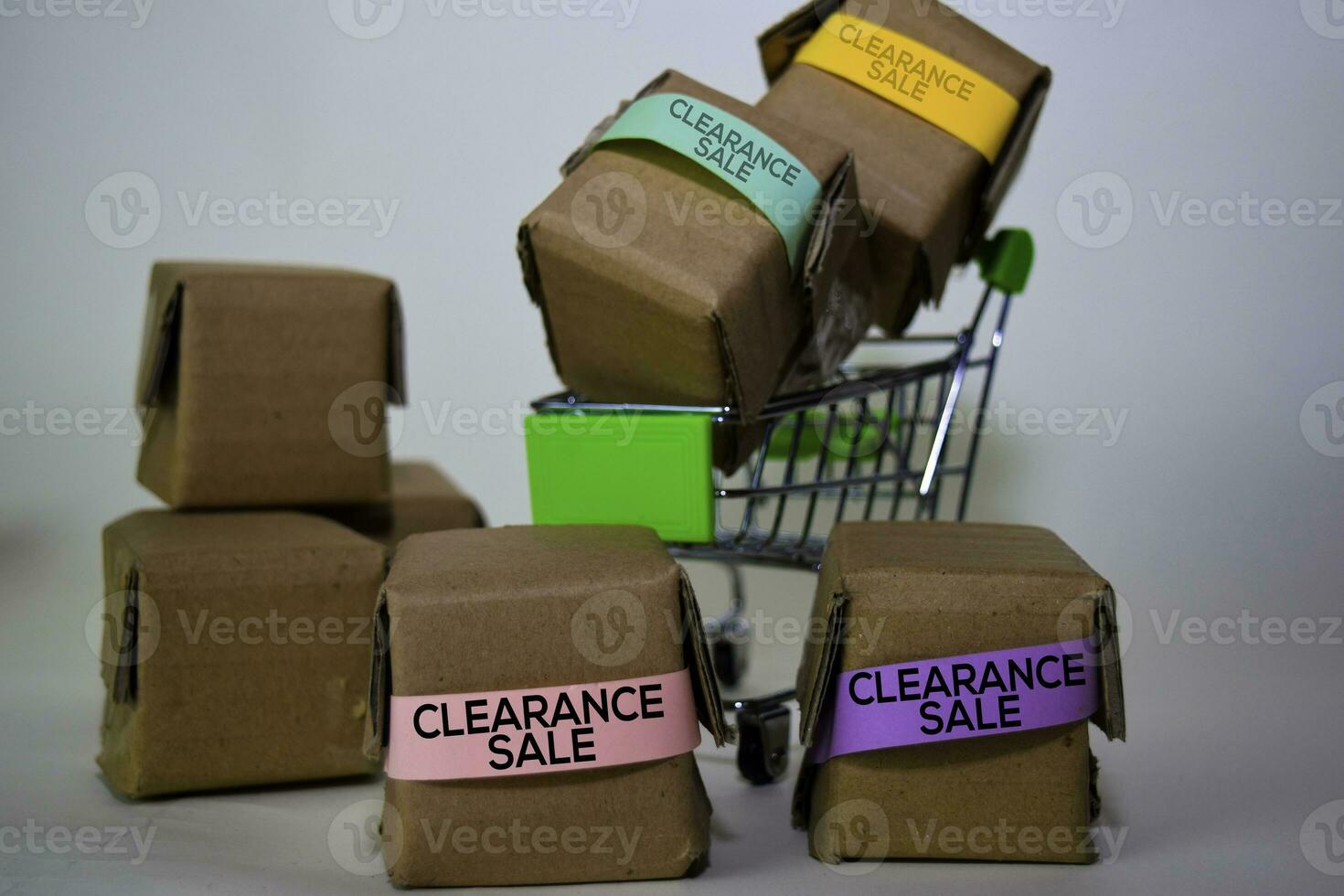 Clearance Sale Text in small boxes and shopping cart. Concepts about online shopping. Isolated on white background photo