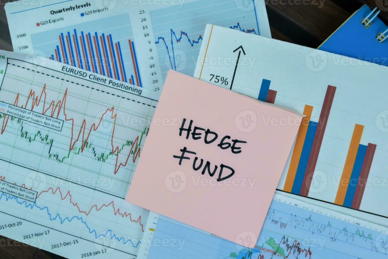 Concept of Hedge Fund write on sticky notes isolated on Wooden Table. photo