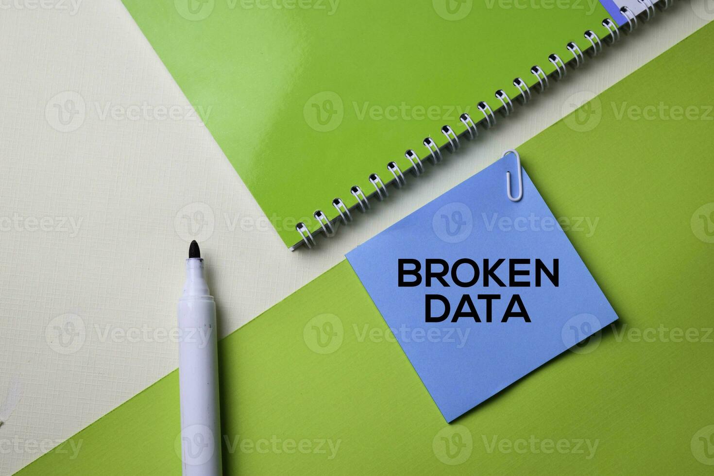 Broken Data text on top view office desk table of Business workplace and business objects. photo