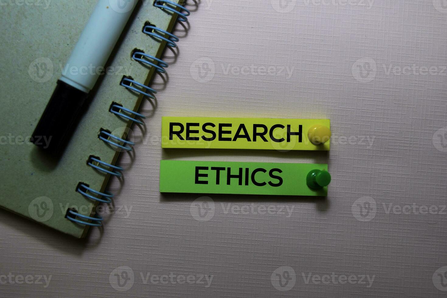 Research Ethics text on sticky notes isolated on office desk photo