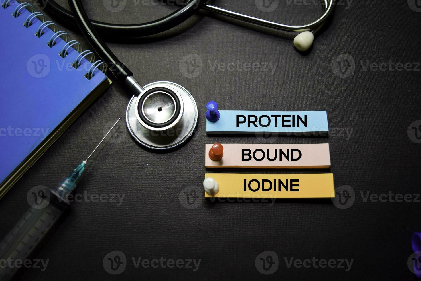 Protein Bound Iodine text on Sticky Notes. Top view isolated on black background. Healthcare Medical concept photo