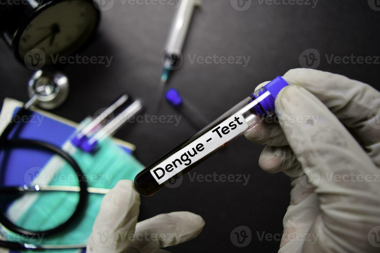 Dengue - Test with blood sample. Top view isolated on black background. Healthcare Medical concept photo