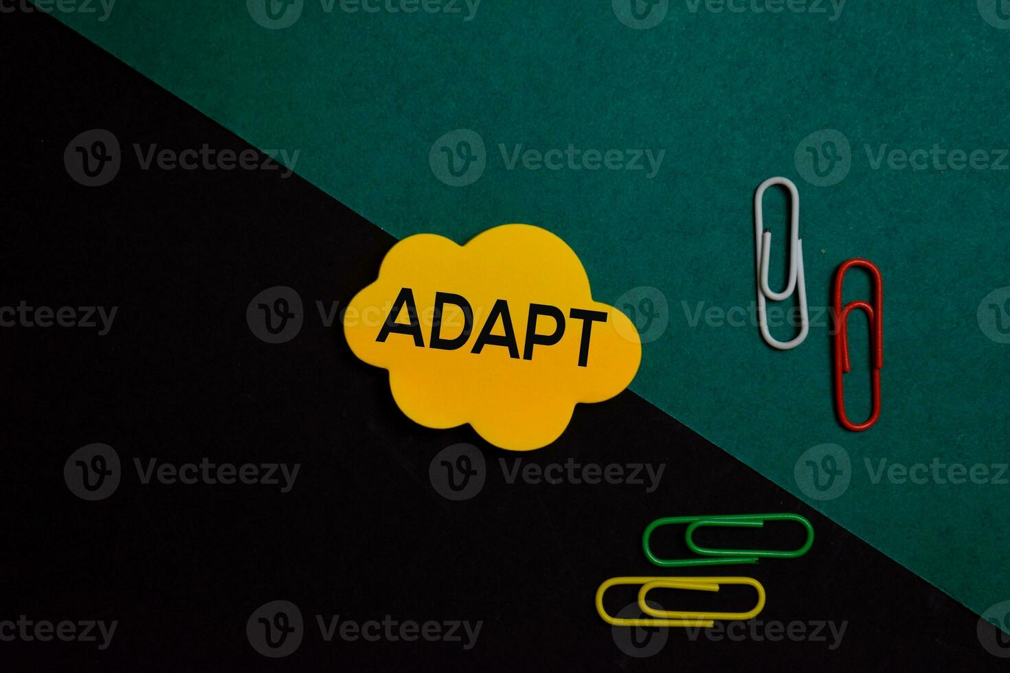 Adapt write on a sticky note isolated on Office Desk photo