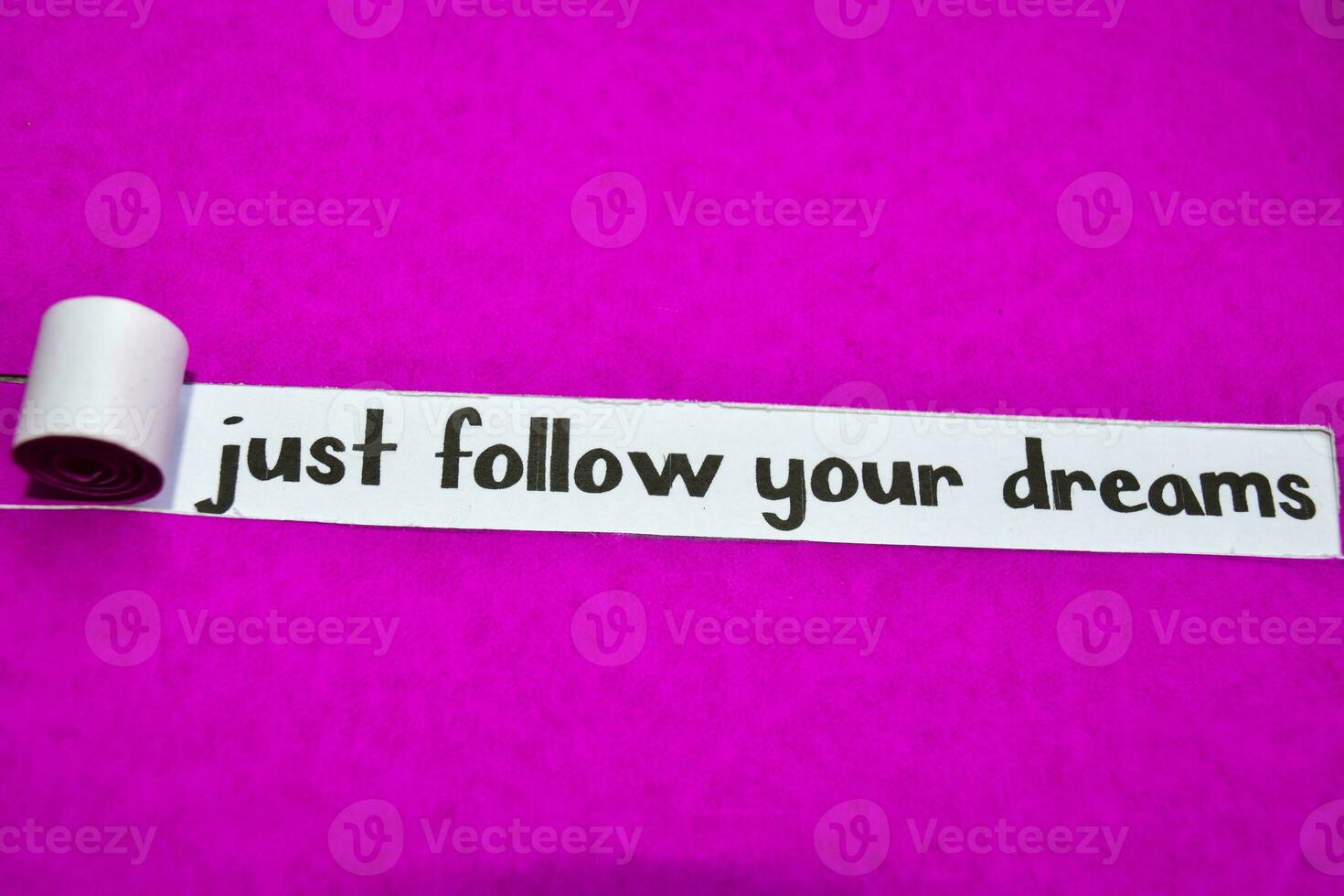 Just Follow your Dreams text, Inspiration, Motivation and business concept on purple torn paper photo