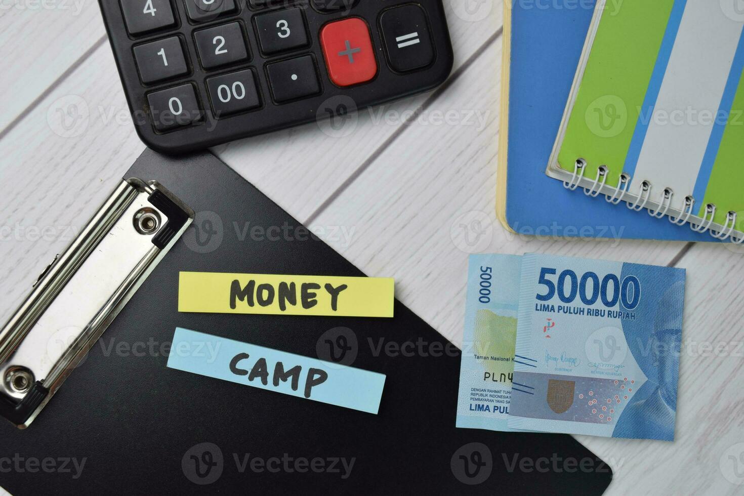 Money Camp text write on sticky notes isolated on office desk. photo