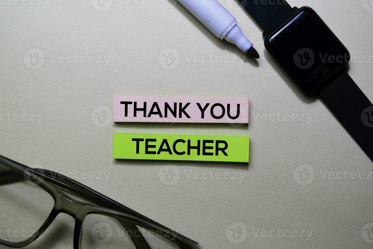 Thank You Teacher text on sticky notes isolated on office desk photo