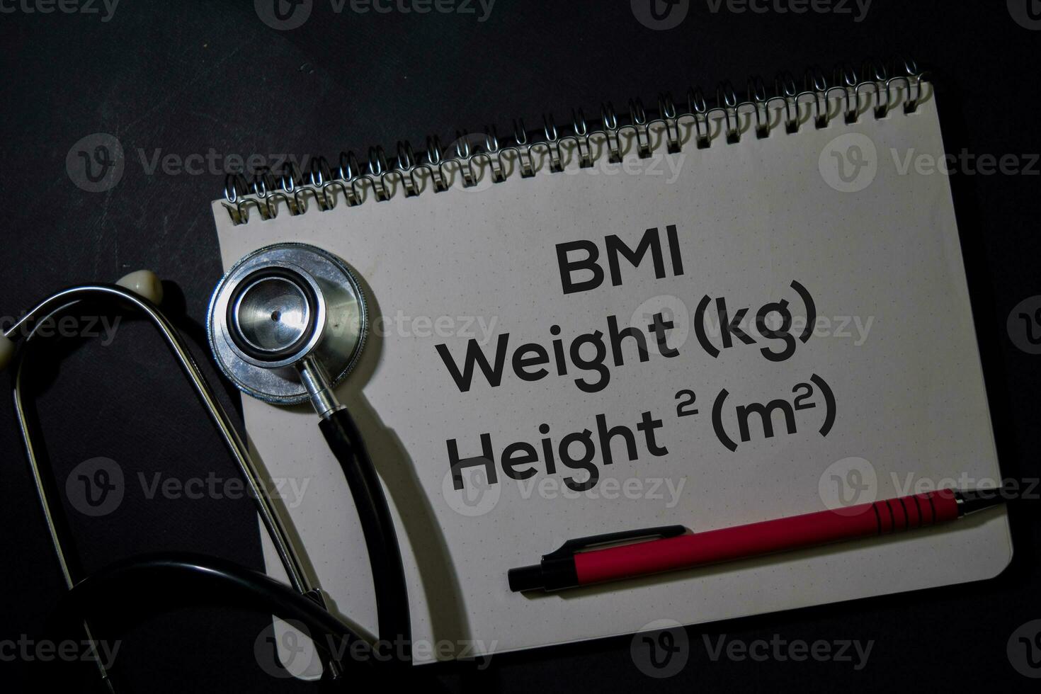 BMI - Weight and Height write on a book isolated on Office Desk. Healthcare or Medical Concept photo
