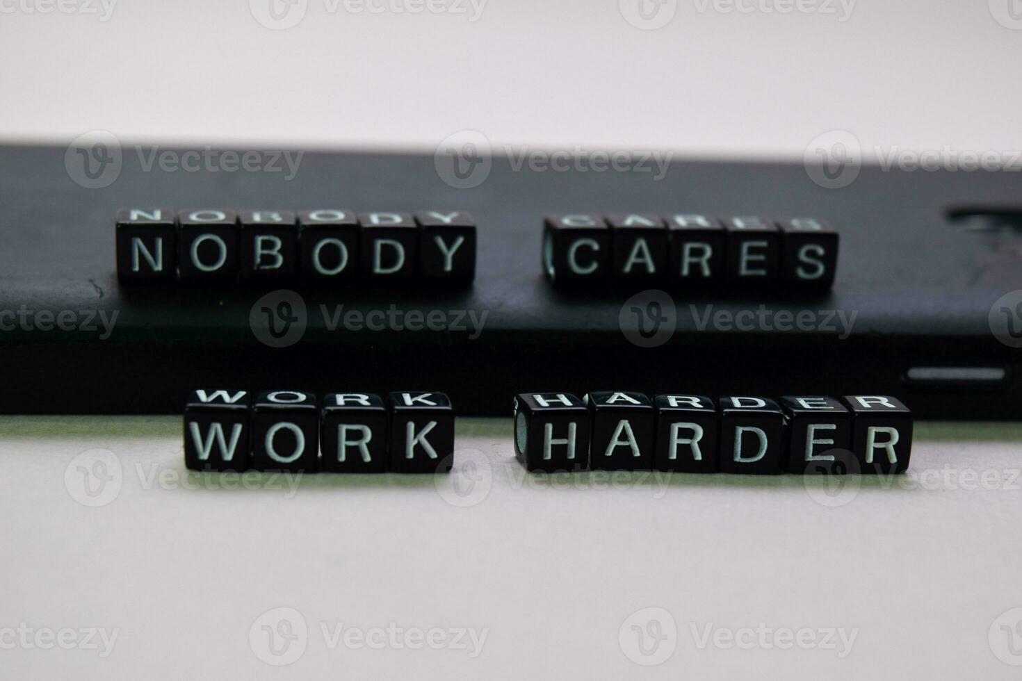 Nobody cares. Work harder on wooden blocks. Motivation and inspiration concept photo