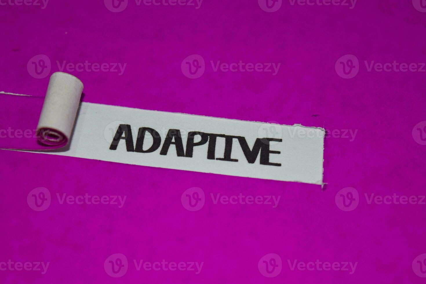Adaptive text, Inspiration and positive vibes concept on purple torn paper photo