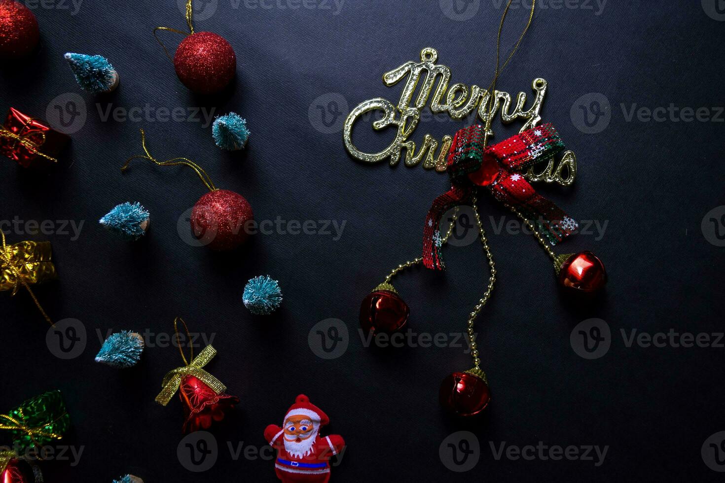 Santa Claus, merry christmas text and Decorative Christmas isolated on black background photo
