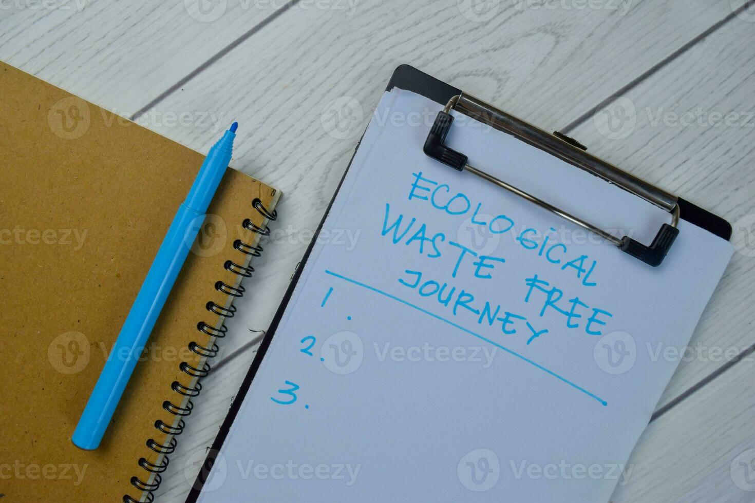 Ecological Waste Free Journey write on a paperwork and supported by additional services isolated on Wooden Table. photo