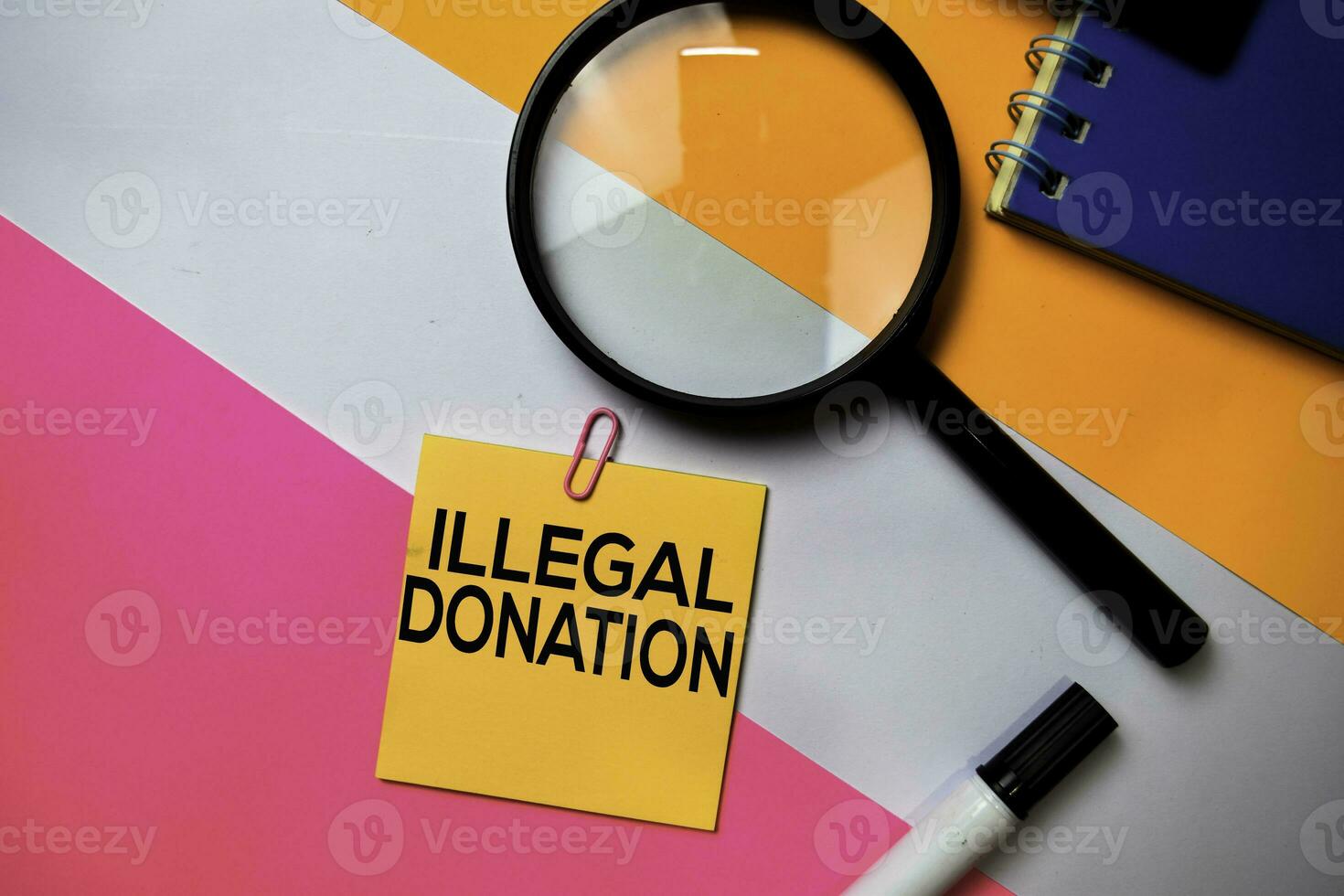 Illegal Donation text on sticky notes with color office desk concept