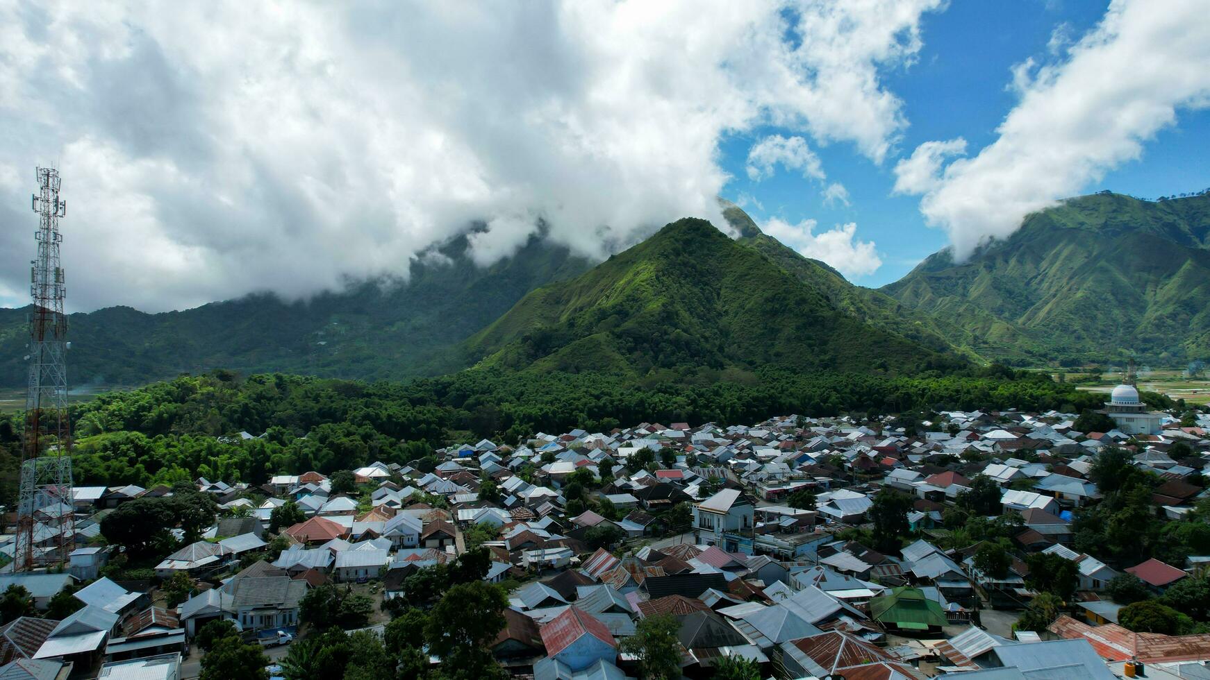 Aerial view of some agricultural fields in Sembalun. Sembalun is situated on the slope of mount Rinjani and is surrounded by beautiful green mountains. Lombok, Indonesia, March 22, 2022 photo