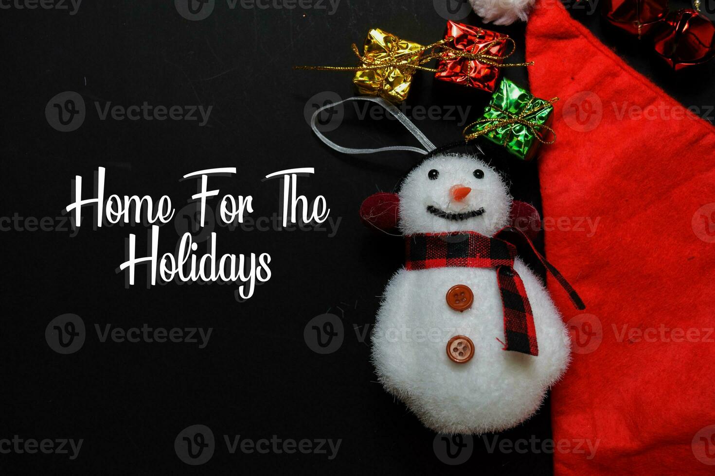 Home For The Holidays text isolated on black backgroud. Frame of Christmas Decoration. photo