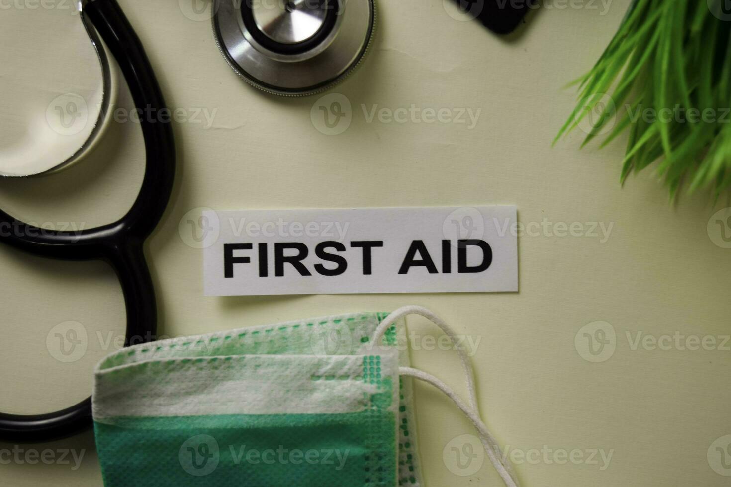 First Aid with inspiration and healthcare medical concept on desk background photo