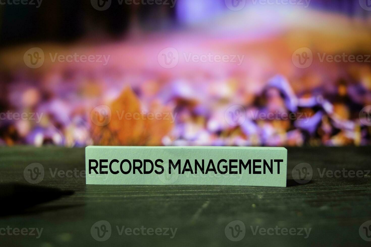 Records Management on the sticky notes with bokeh background photo