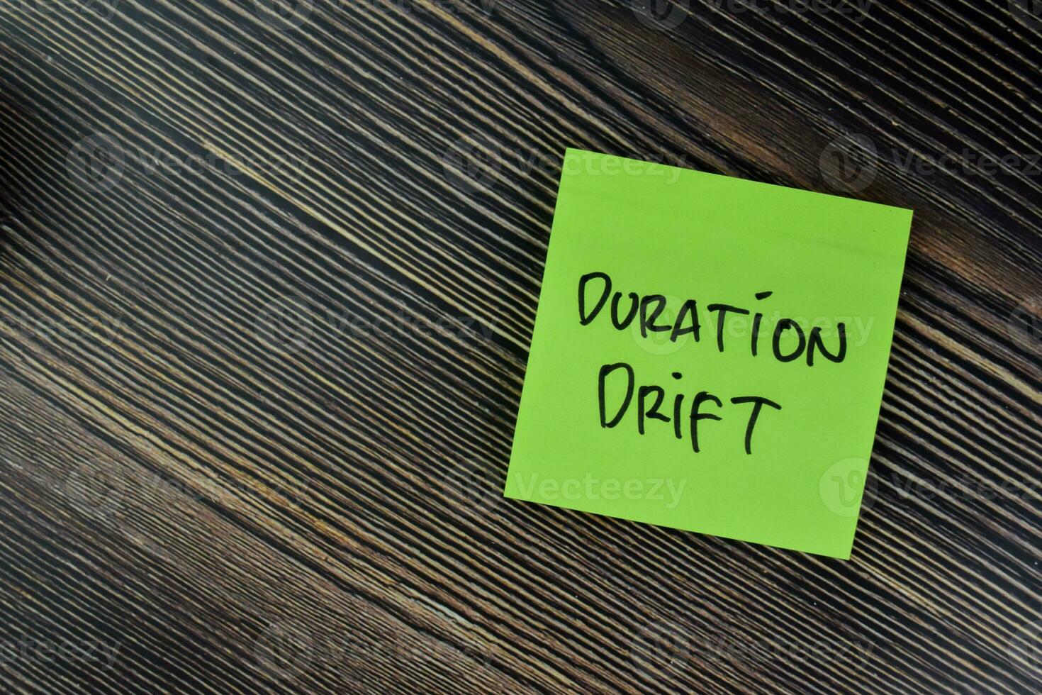 Concept of Duration Drift write on sticky notes isolated on Wooden Table. photo