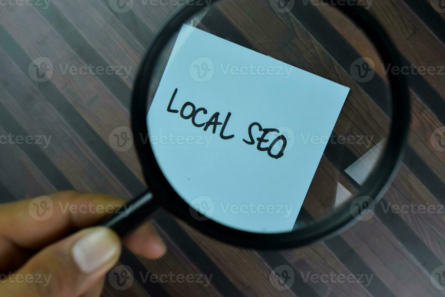 Local SEO write on sticky notes isolated on Wooden Table. photo