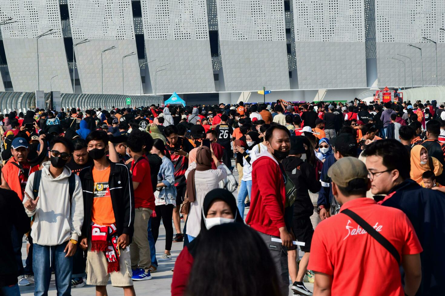 Crowds on Group of fans on the stadium Jakarta International Stadium. Jakarta, Indonesia, August 1, 2022 photo