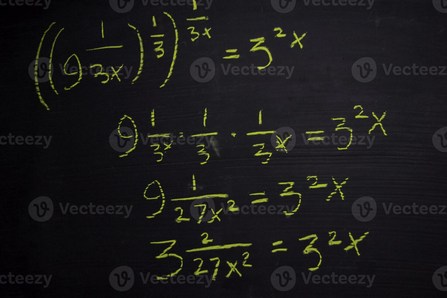 Close up math formulas written on a blackboard. Education concept photo