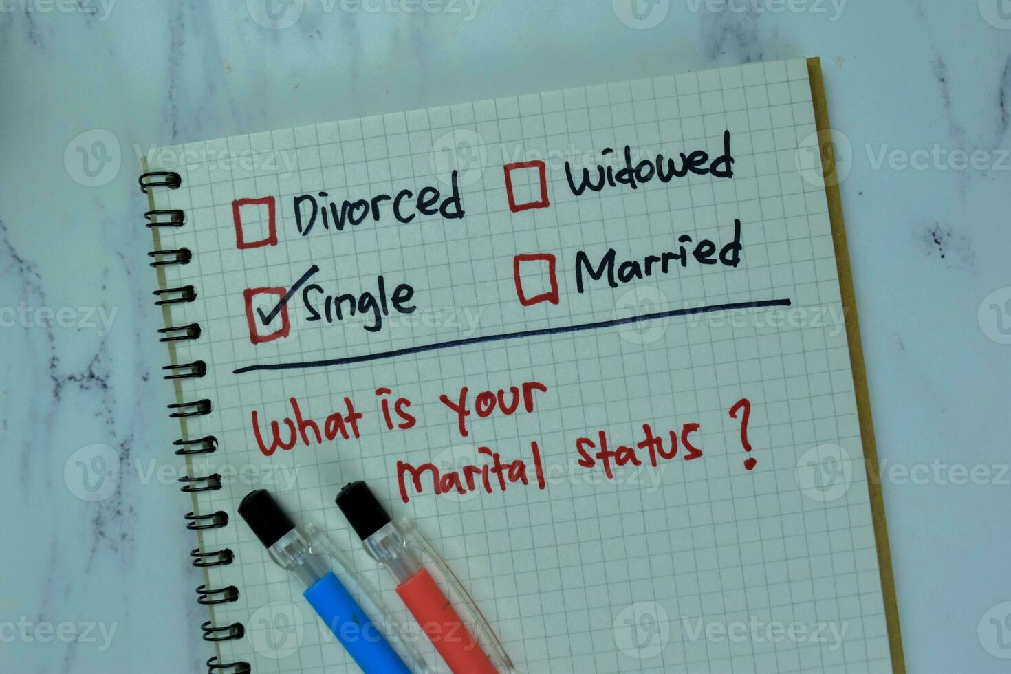 Concept of What is Your Marital Status write on a book isolated on Wooden Table. photo