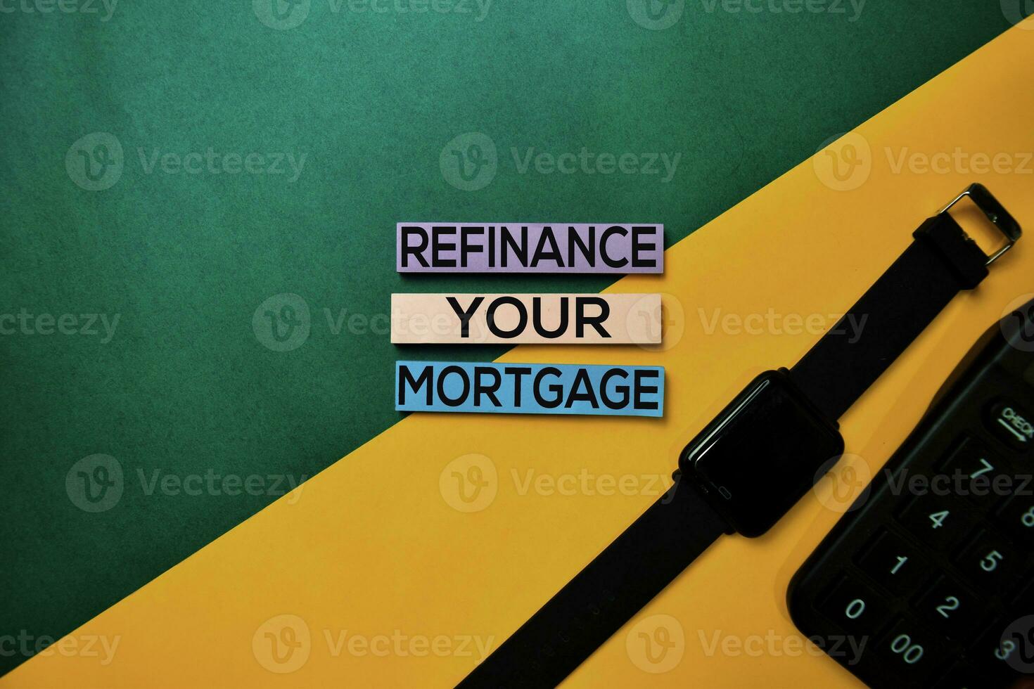 Refinance Your Mortgage text on top view color table background. photo