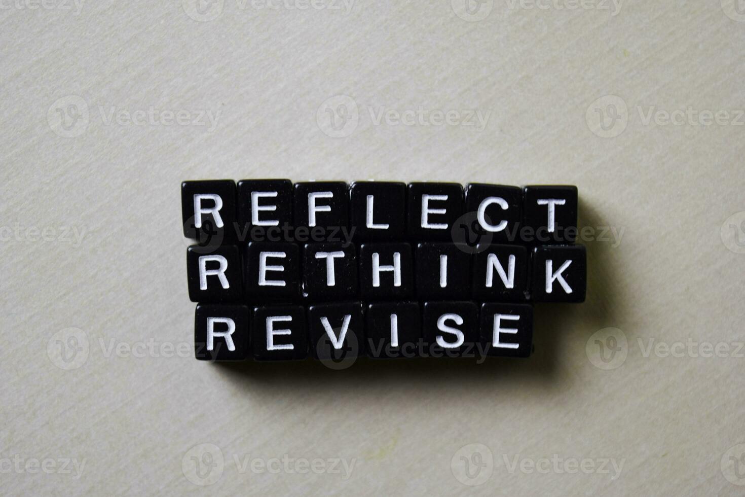 Reflect - Rethink - Revise on wooden blocks. Business and inspiration concept photo