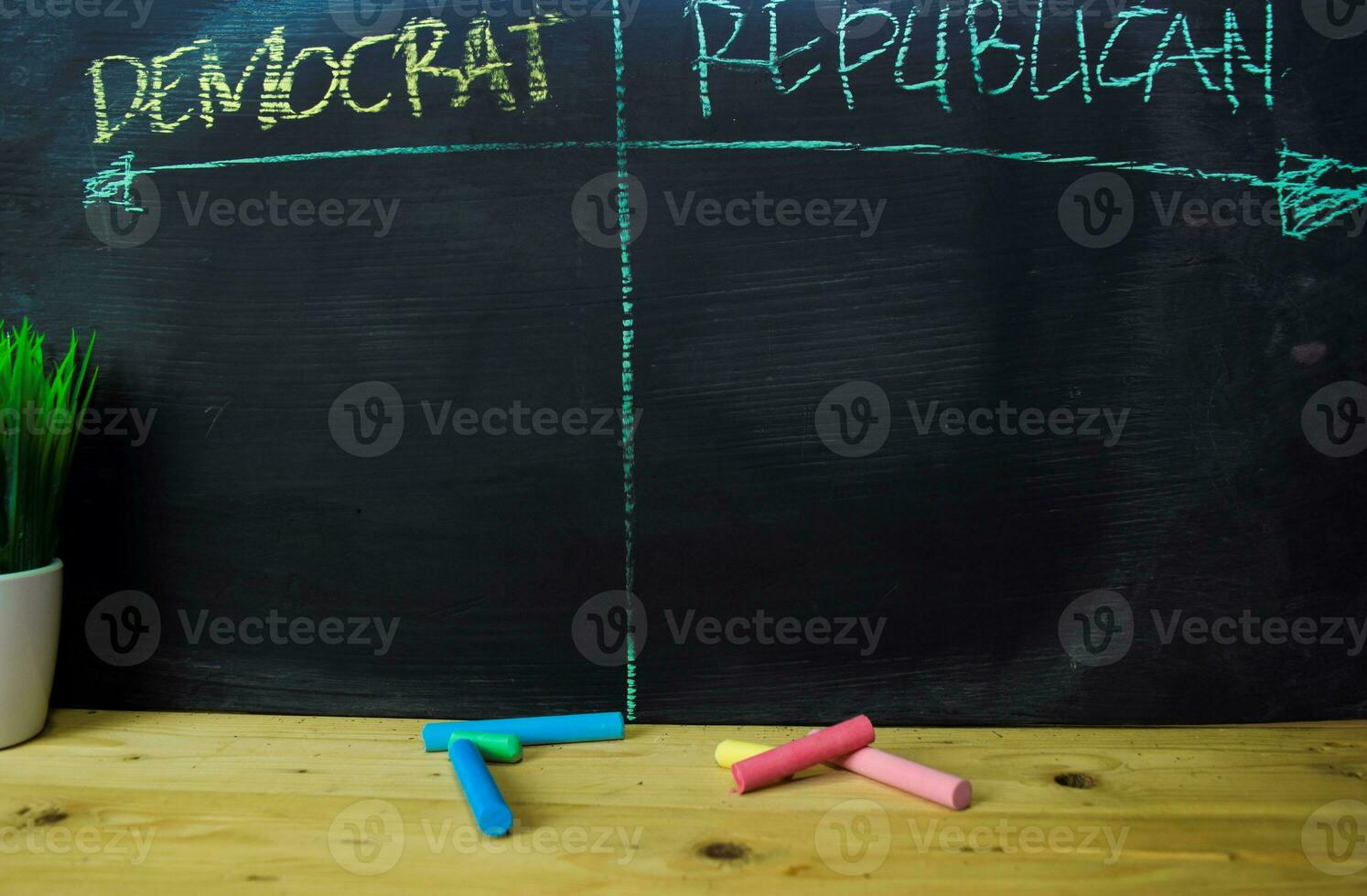 Democrat or Republican written with color chalk concept on the blackboard photo