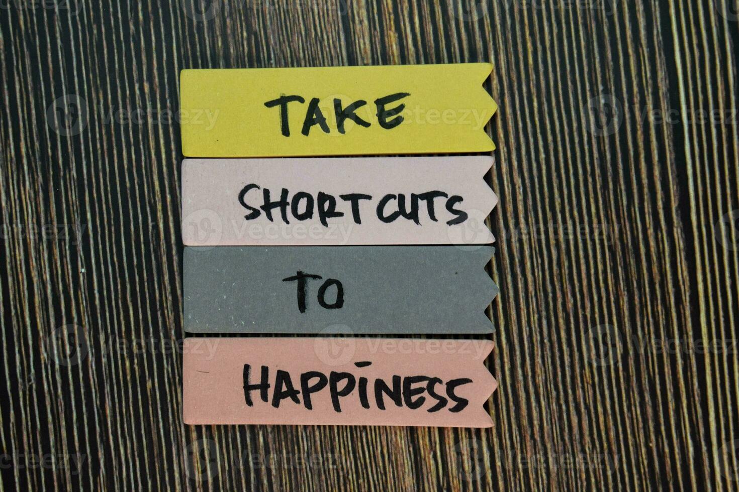 Take Shortcuts to Happiness write on sticky notes isolated on Wooden Table. Motivation or Insipiration Concept photo