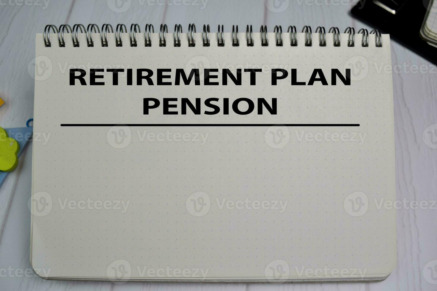 Retirement Plan Pension write on a book isolated on office desk photo