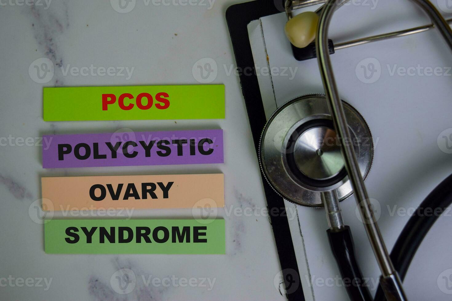 POCS - Polycystic Ovary Syndrome write on sticky notes isolated on Wooden Table. photo