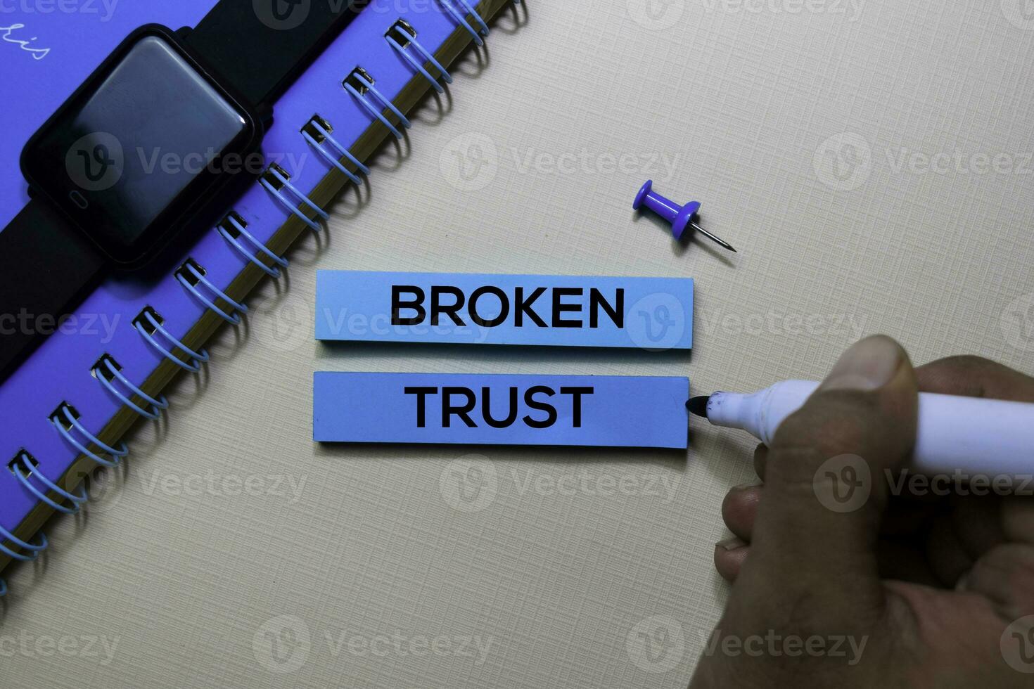 Broken Trust text on sticky notes isolated on office desk photo