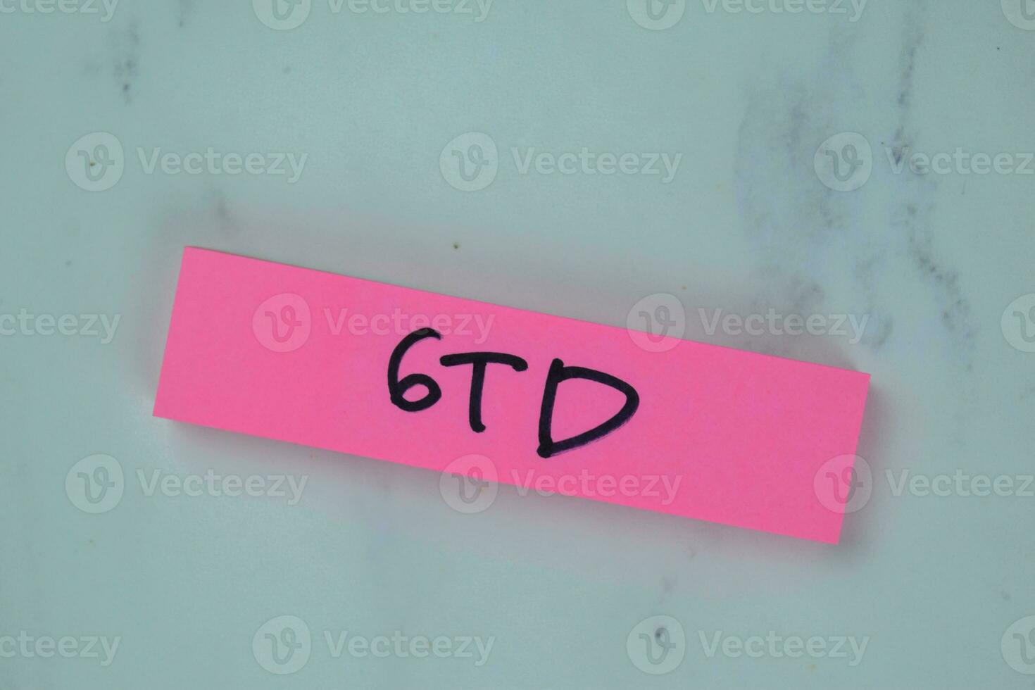 GTD - Getting Things Done write on sticky notes isolated on Wooden Table. photo
