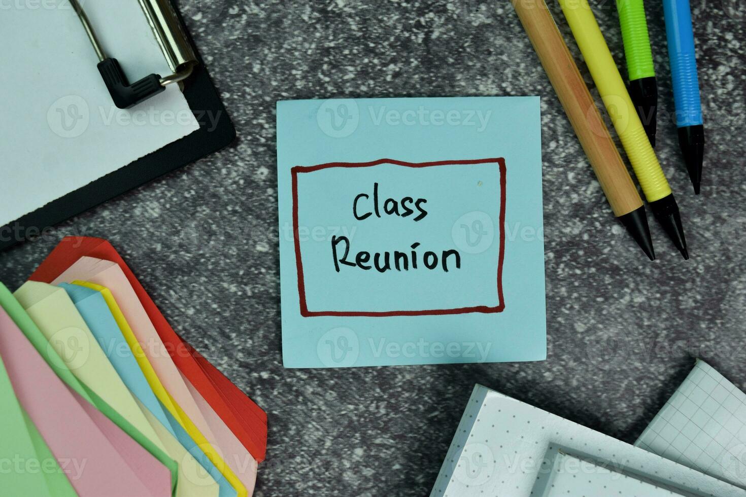 Class Reunion write on sticky notes on the table. Education concept photo