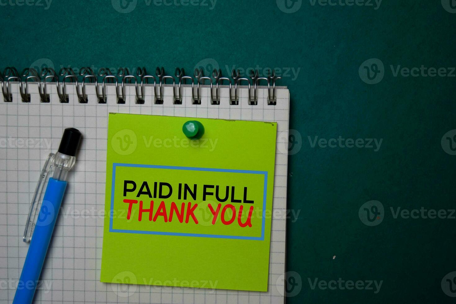 Paid in Full - Thank You write on a sticky note isolated on green background. photo