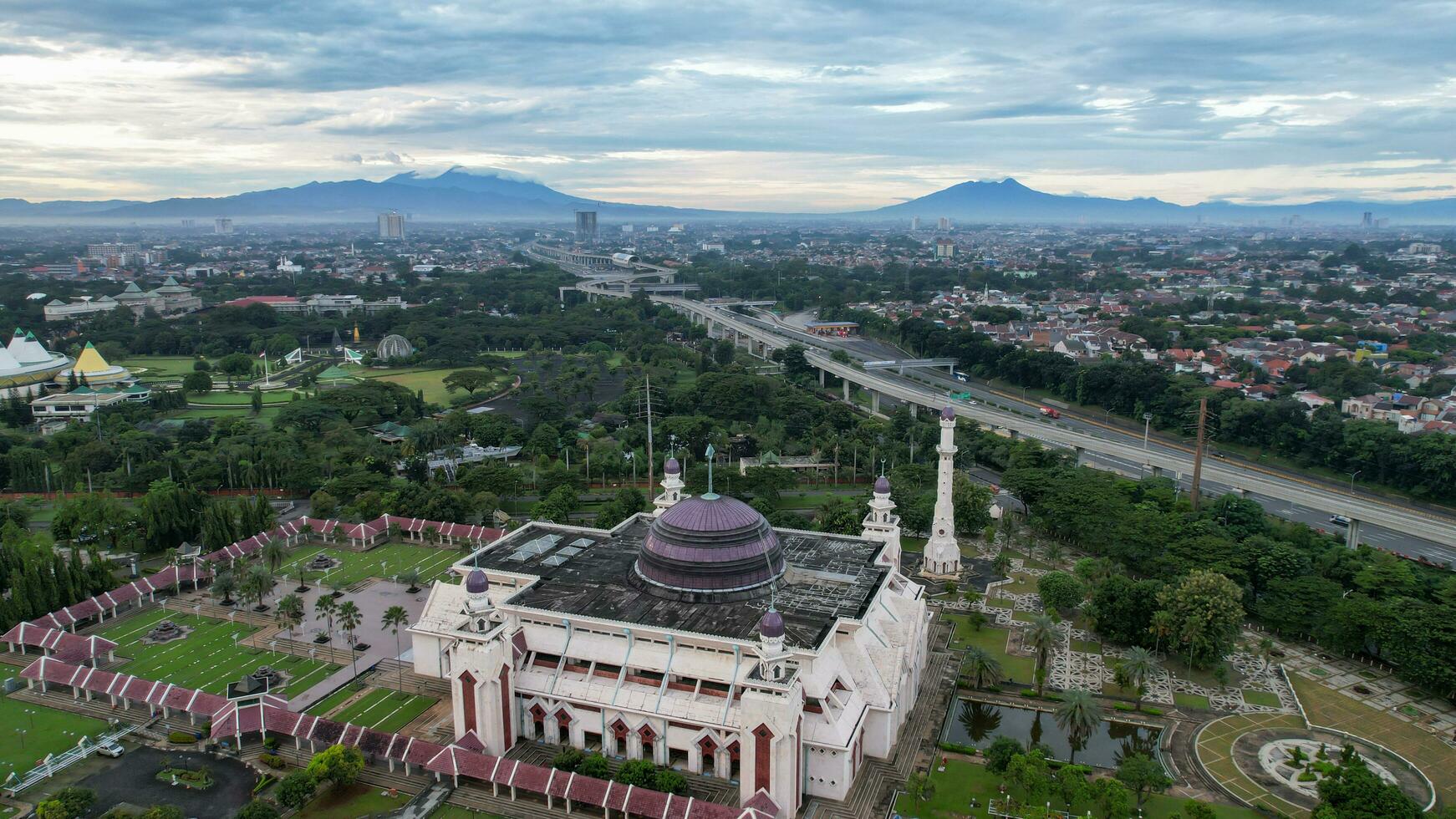 Aerial view of At Tin Grand Mosque, where this mosque is the largest mosque in Indonesia which is located in East Jakarta with mountain view. Jakarta, Indonesia, March 8, 2022 photo