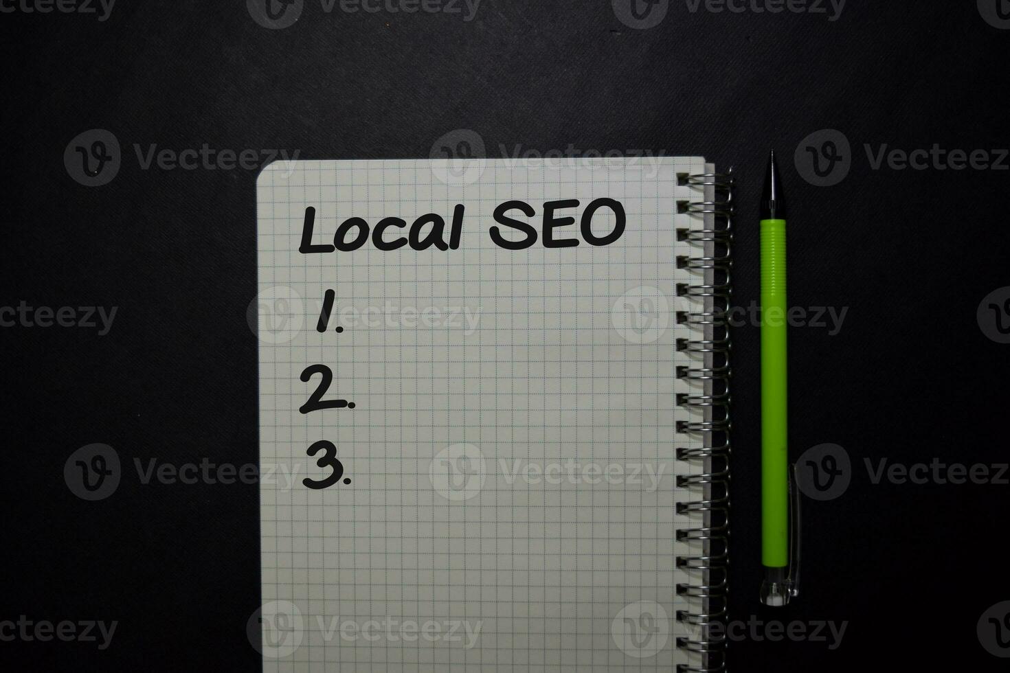 Local SEO write on a book isolated on black table. photo