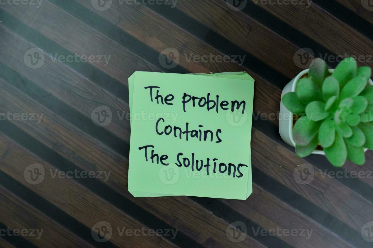 Concept of The Problem Contains The Solutions write on sticky notes isolated on Wooden Table. photo