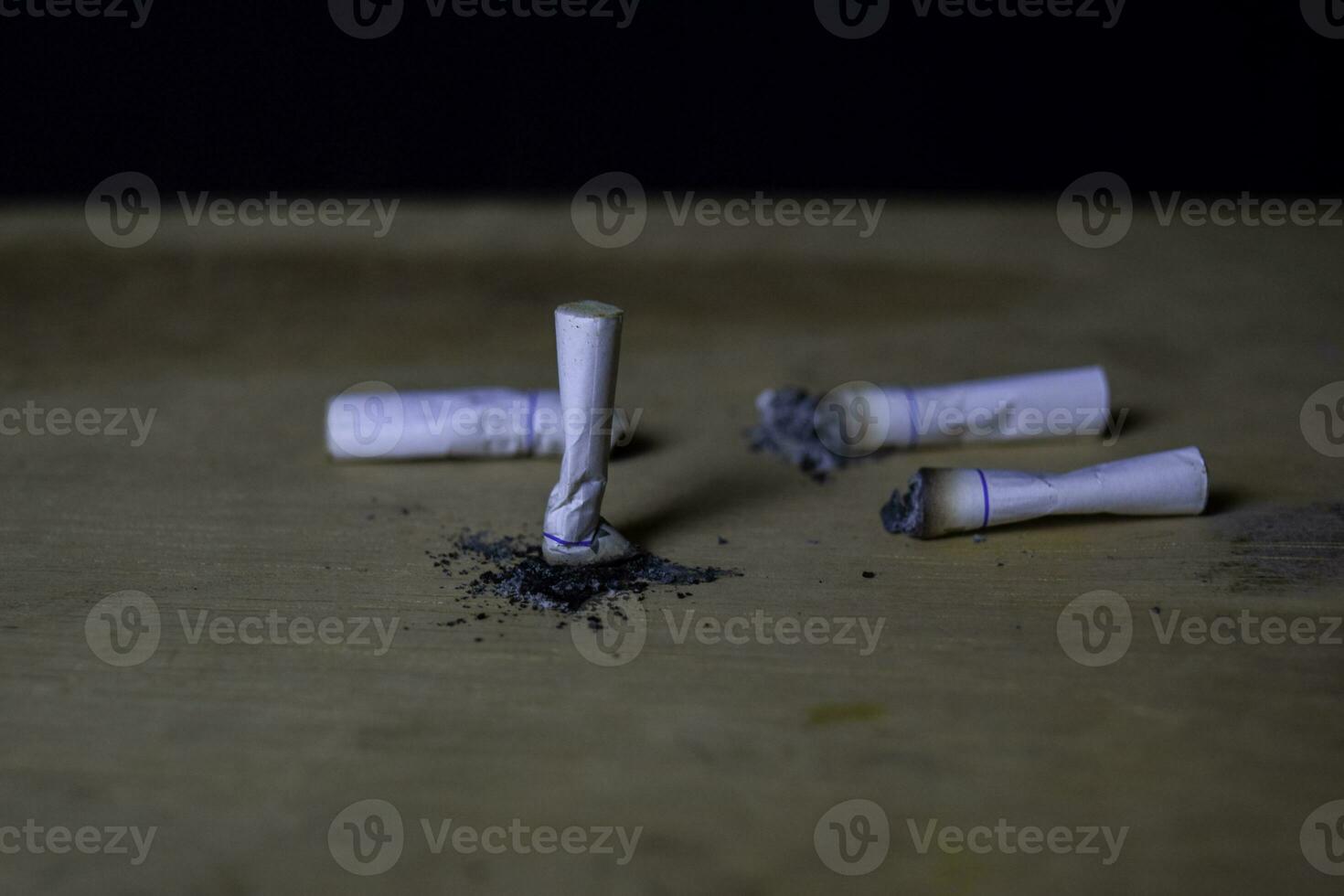 cigarettes on wooden table with black background. Smoking cigarettes concept photo