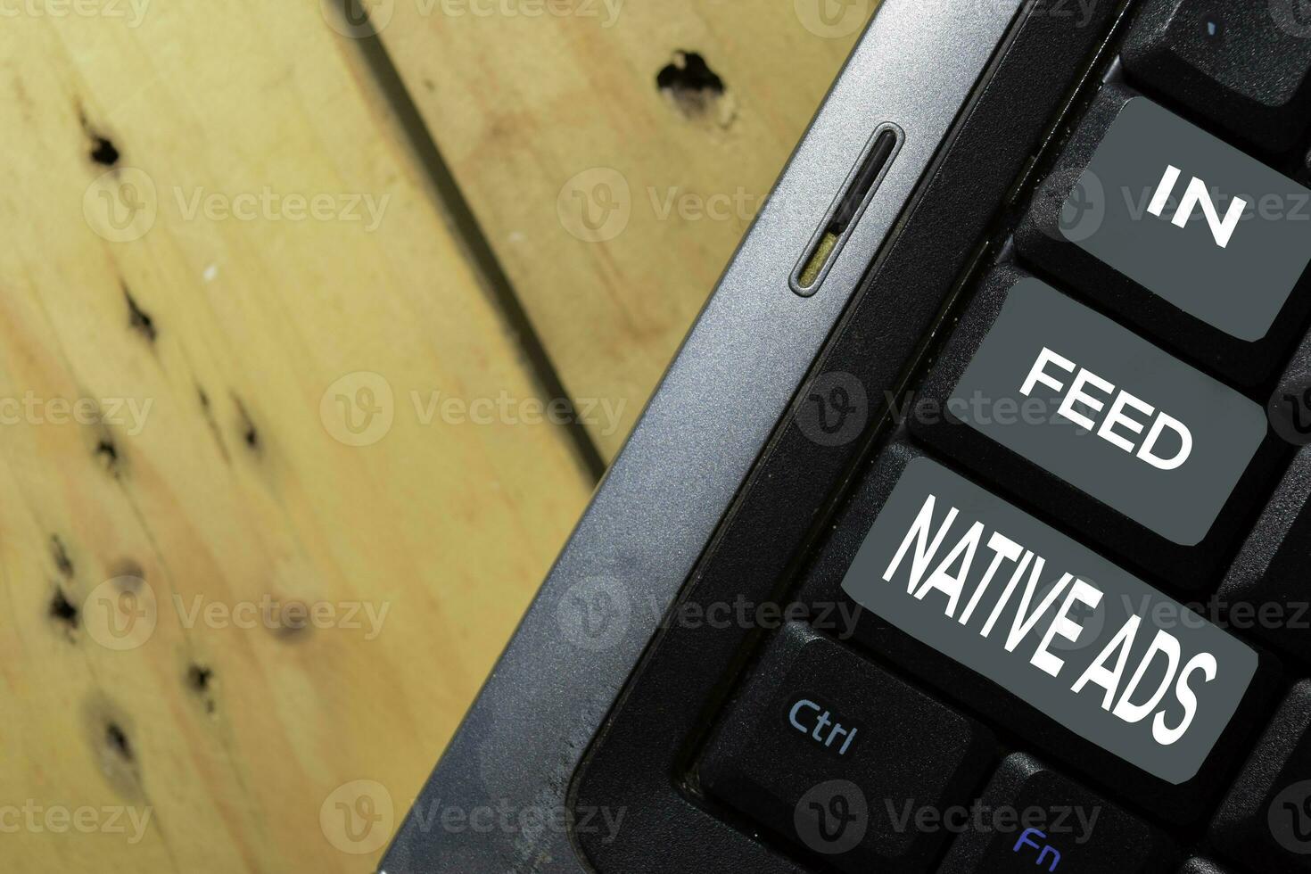 In-Feed Native Ads write on keyboard isolated on laptop background photo