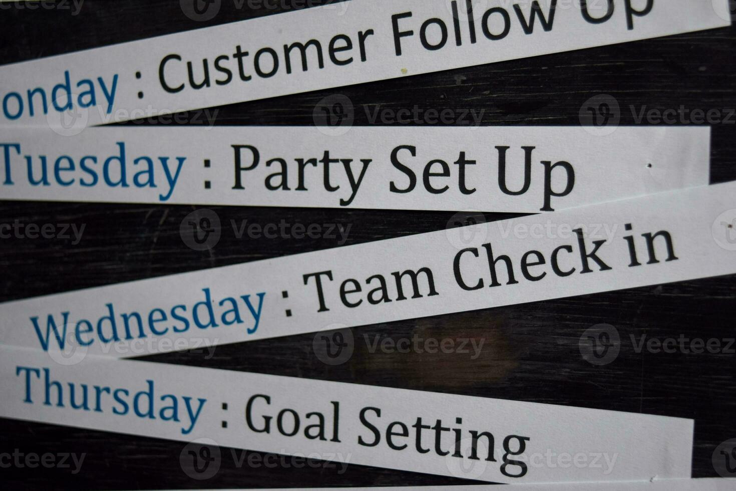 Close up making agenda weekly schedule on personal organizer. Business and entrepreneur concept. Isolated on blackboard photo