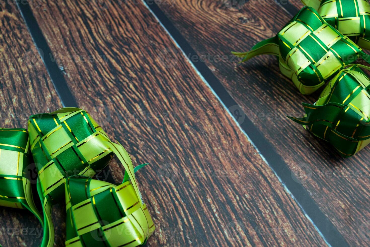 ketupat or rice dumpling on a wooden table. Ramadan Kareem and Eid Mubarak concept photo