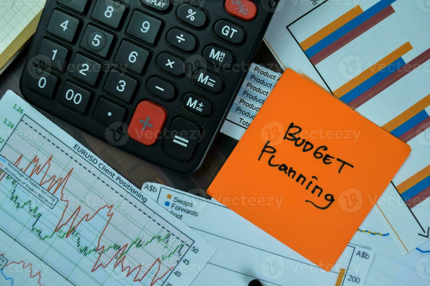 Concept of Budget Planning write on sticky notes isolated on Wooden Table. photo