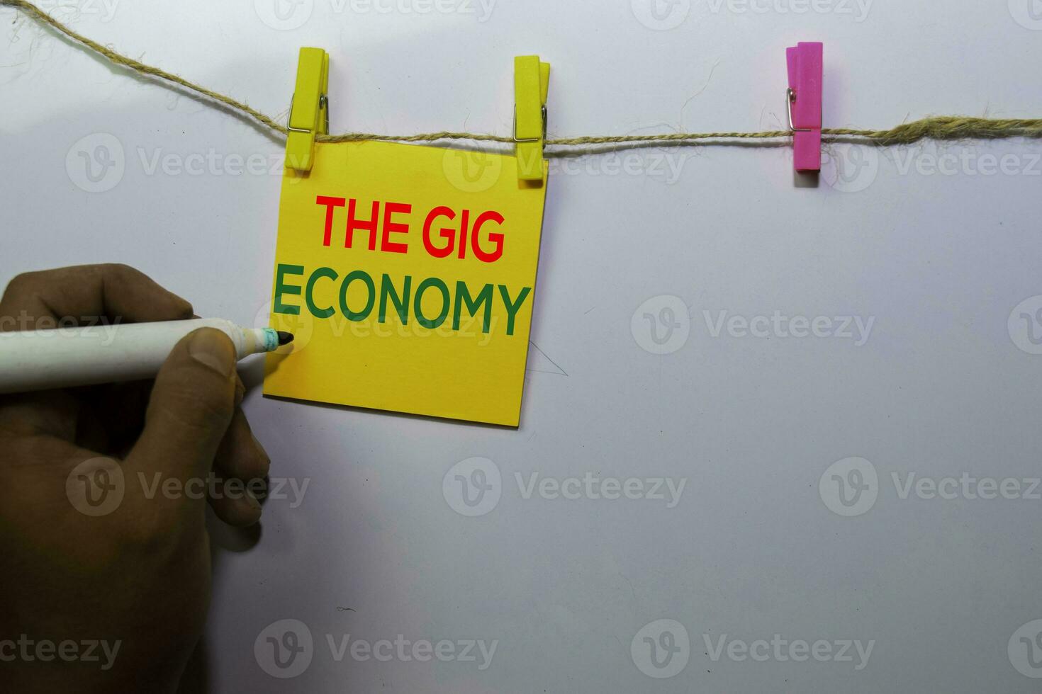 The Gig Economy isolated on white board background. photo