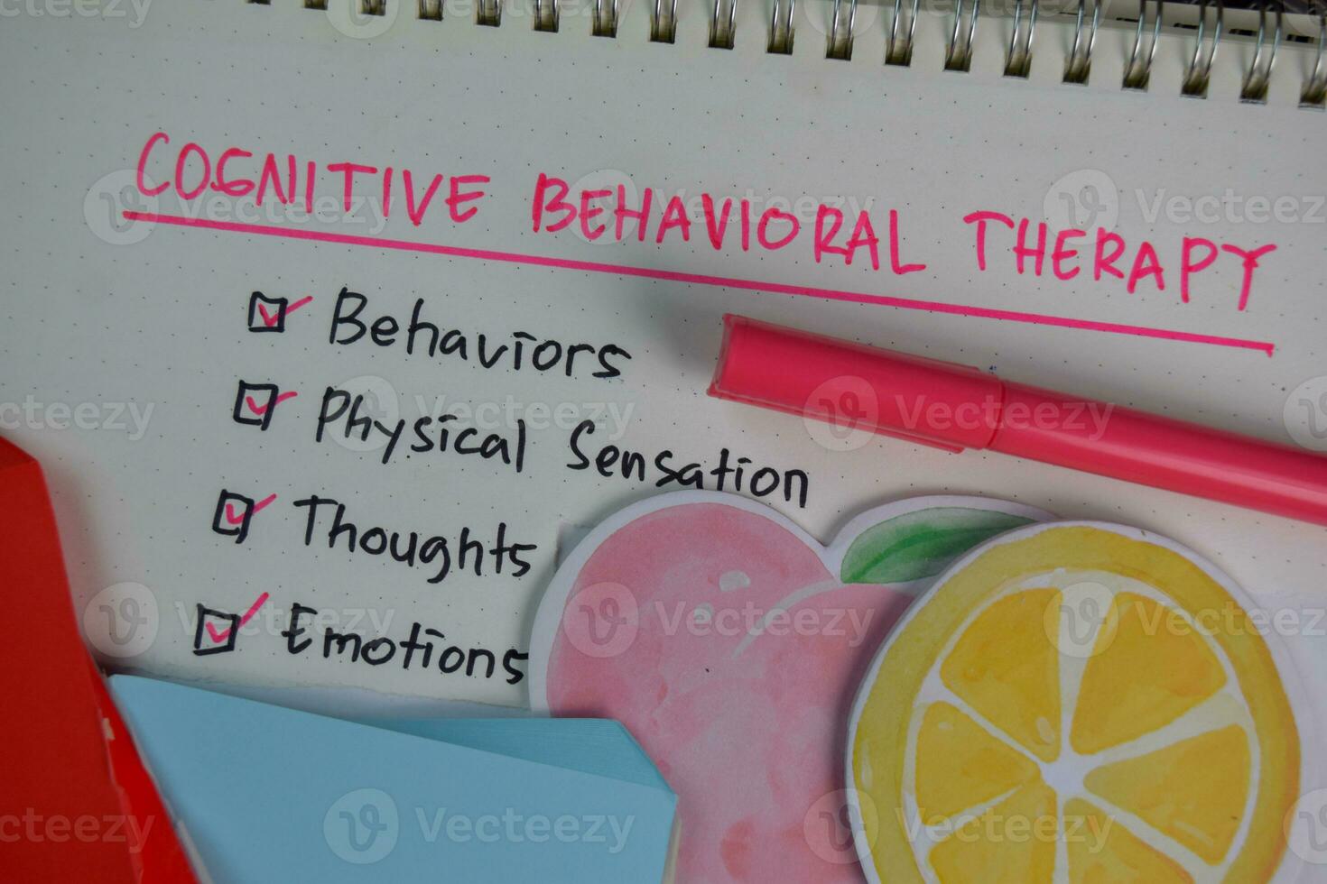 Cognitive Behavioral Therapy write on a book with keywords isolated on Wooden Table. Chart or mechanism concept photo