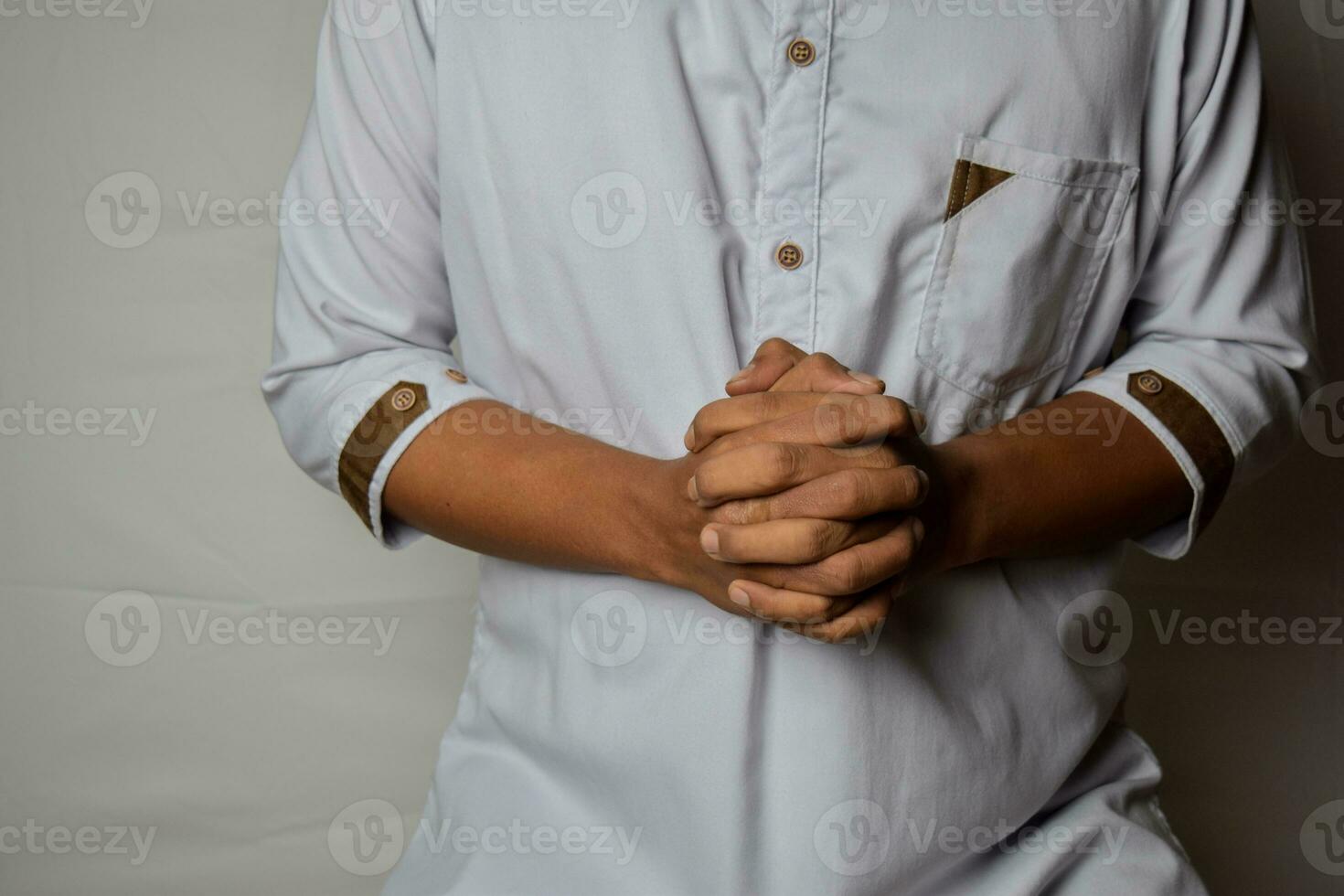 Close up Asian man shows hand gestures it means human emotion and expression isolated on white background photo