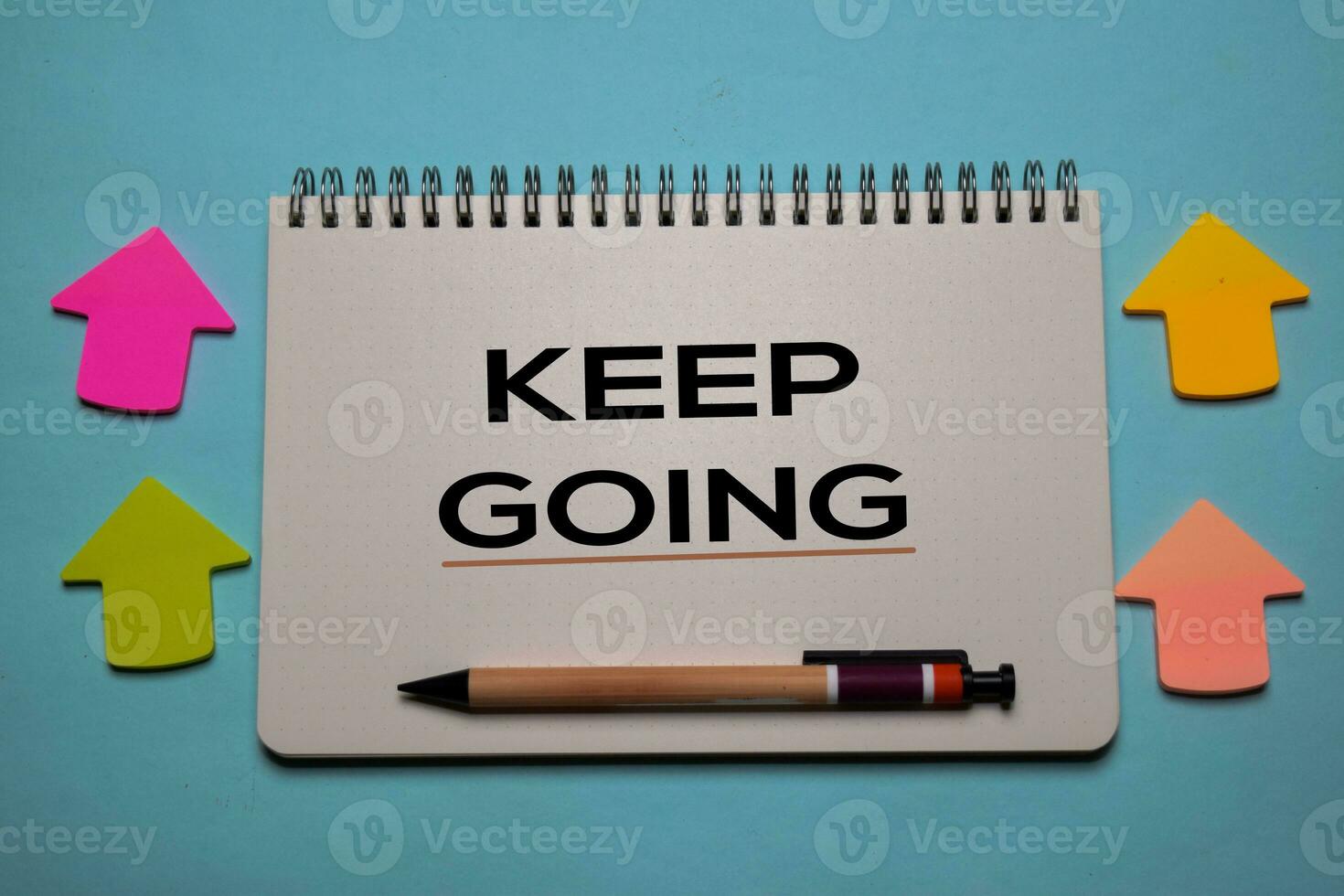 Keep Going write on a book isolated on office desk. Christian faith concept photo